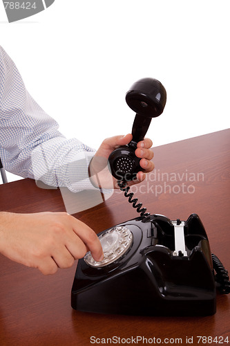 Image of dialing a number on the telephone