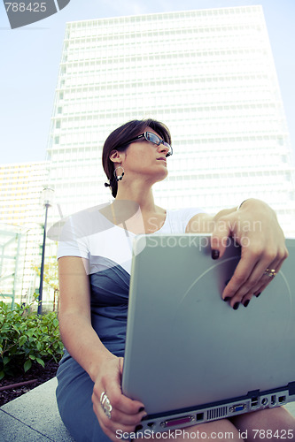 Image of businesswoman working outdoor