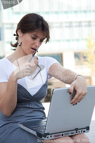 Image of businesswoman working outdoor