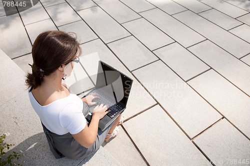Image of businesswoman working outdoor