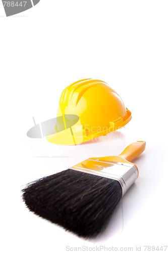 Image of construction helmet and a paint brush