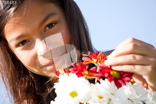 Image of Little child with fresh flowers