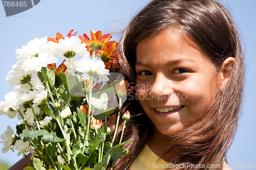 Image of Little child with fresh flowers