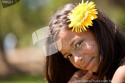 Image of child with a flower in the head