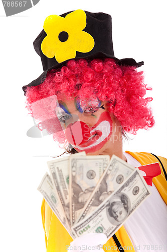 Image of Funny clown holding money