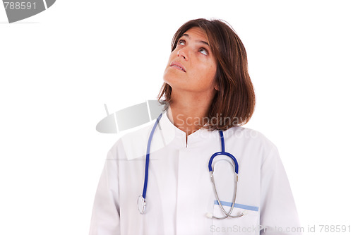 Image of woman doctor looking up