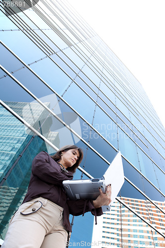 Image of Businesswoman working outdoor