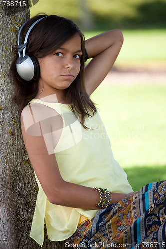 Image of young child listening music