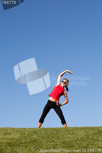 Image of woman doing exercise outdoor