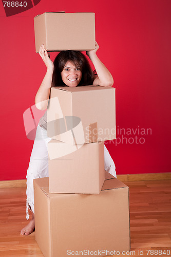 Image of Woman holding cardboard boxes