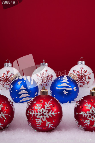 Image of Christmas balls over a red background