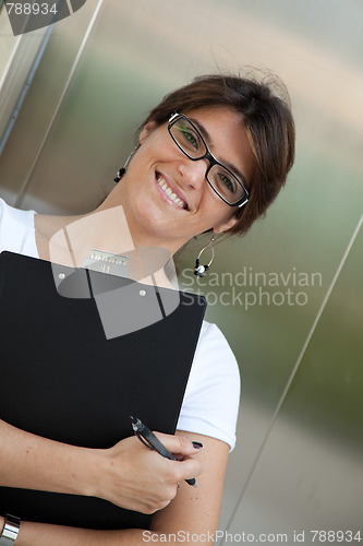 Image of Businesswoman next to the elevator