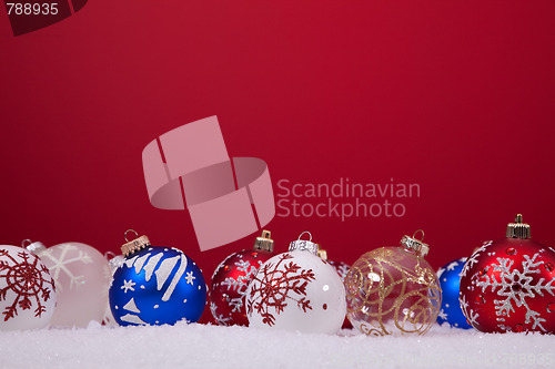 Image of Christmas balls over a red background