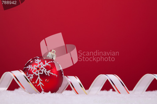 Image of Christmas balls over a red background