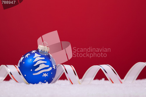 Image of Christmas balls over a red background