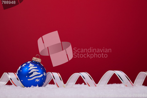 Image of Christmas balls over a red background