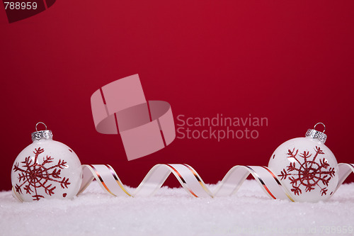 Image of Christmas balls over a red background