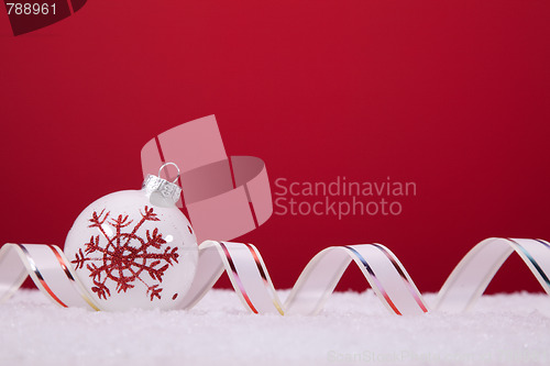 Image of Christmas balls over a red background