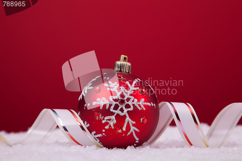 Image of Christmas balls over a red background