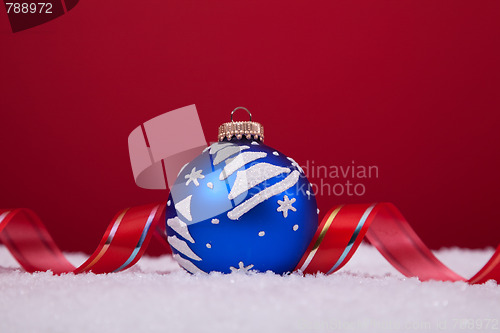 Image of Christmas balls over a red background
