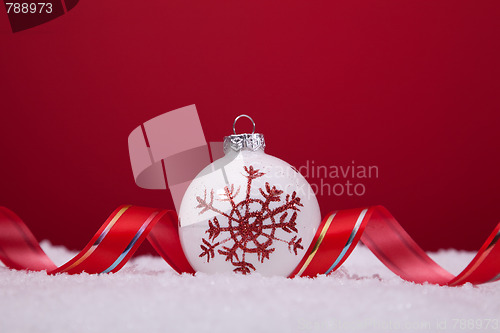 Image of Christmas balls over a red background