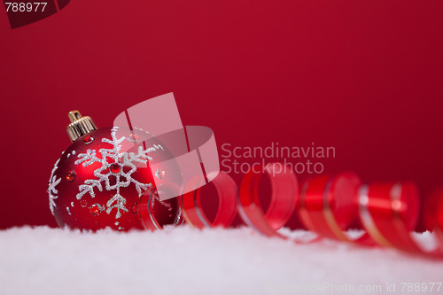 Image of Christmas balls over a red background