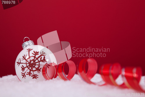 Image of Christmas balls over a red background
