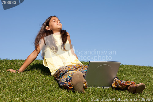 Image of gilr using wireless internet at the park