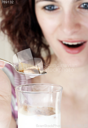 Image of Young people eating milk with cereals
