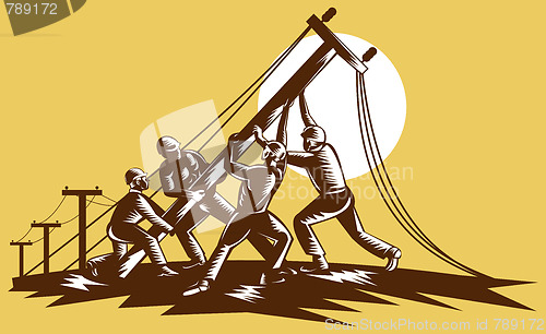 Image of Team of linemen raising up electricity post