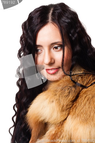 Image of Portrait of beautiful woman with curly hair wearing fur