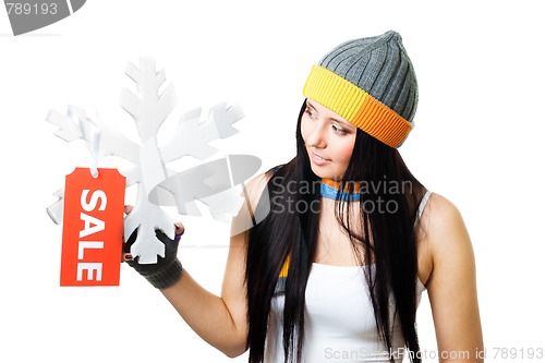 Image of Woman hold snowflake with sale tag