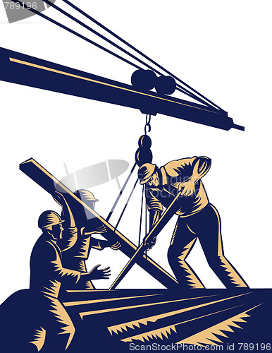 Image of Construction workers hoisting timber