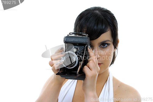 Image of casual young woman photographer