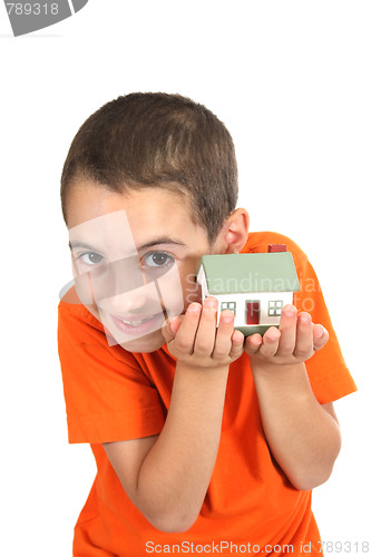 Image of boy holdind a toy house