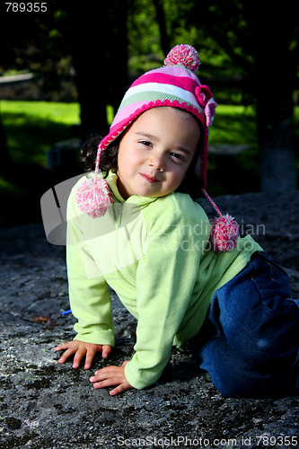 Image of Cute girl in autumn park