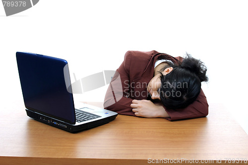 Image of young woman dreaming on laptop