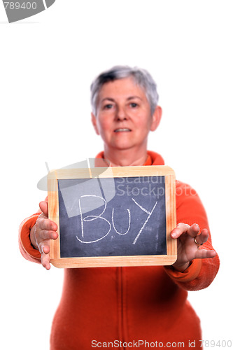 Image of mature woman with board (focus on the board)