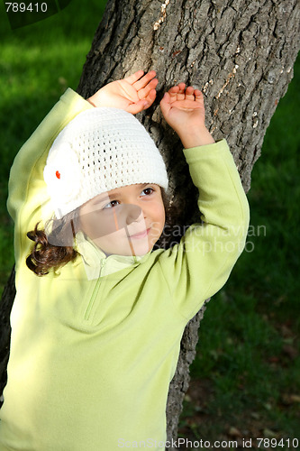 Image of Cute girl in autumn park