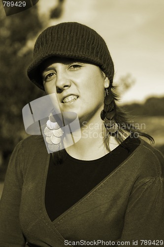 Image of  beautiful woman in an autumn park 