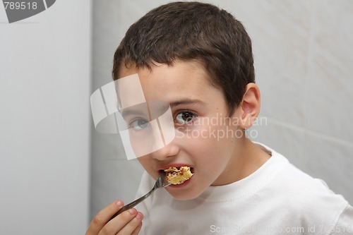 Image of beautiful child eating