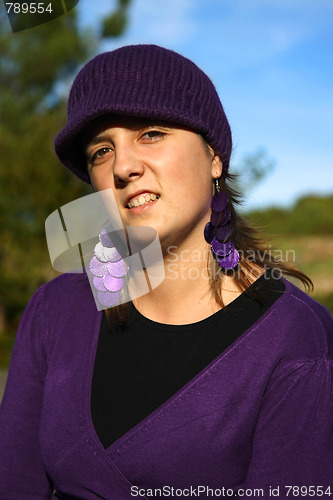 Image of  beautiful woman in an autumn park 