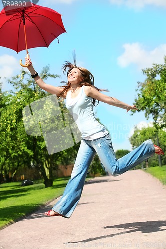 Image of girl jumps with umbrella