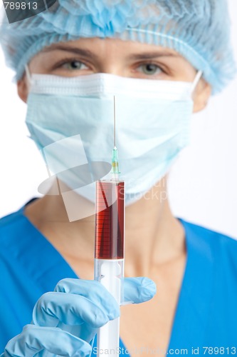 Image of physician with syringe