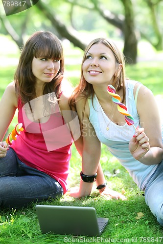 Image of girls with big lollipops