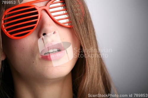 Image of girl in red sunglasses