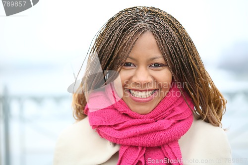 Image of young woman is smiling