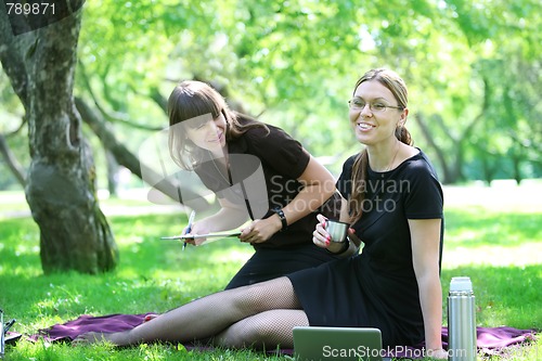 Image of two young woman laughing