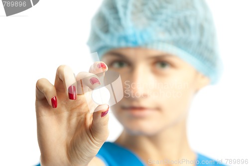 Image of nurse and pill