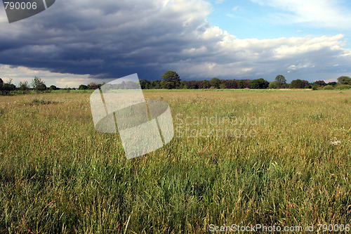 Image of Storm clouds over the field